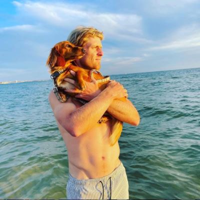 Luke Saville with his pet Tofu Sausage